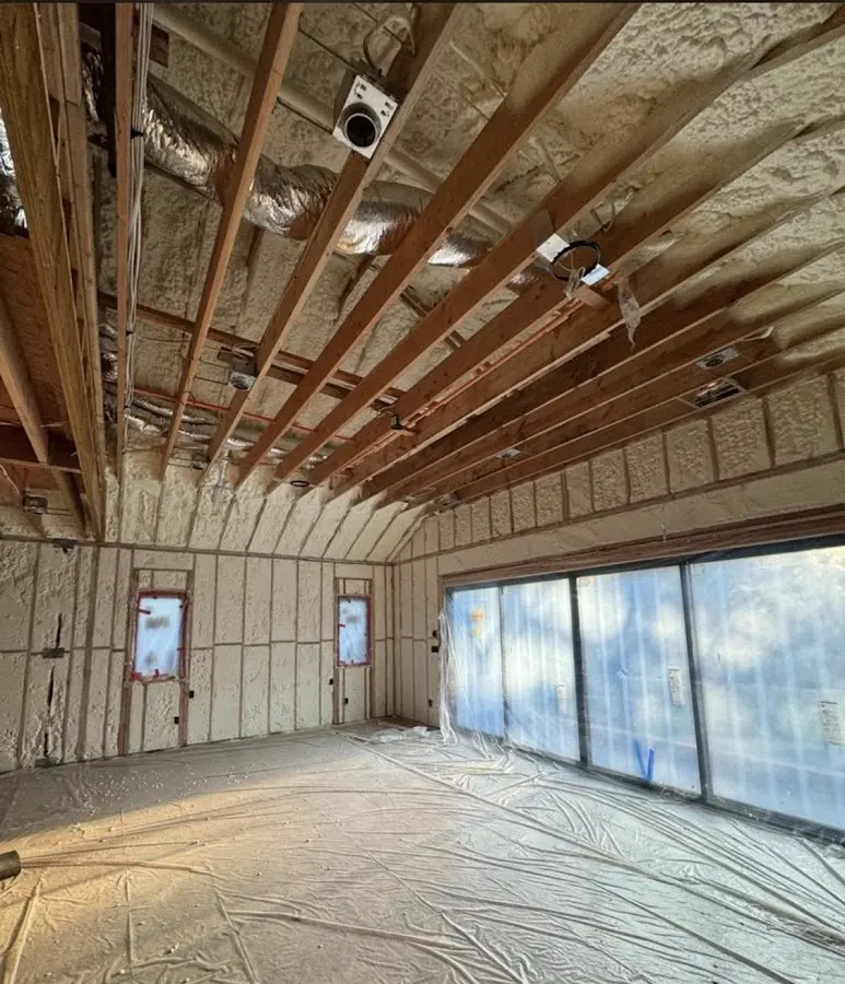 Interior walls and ceiling insulated with spray foam during new construction in West York